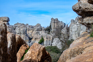 Fototapeta na wymiar Hiking the Torcal de Antequerra National Park, limestone rock formations and known for unusual karst landforms in Andalusia, Malaga, Spain.