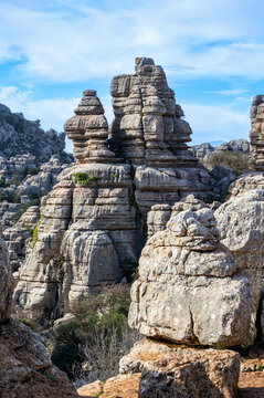 Hiking the Torcal de Antequerra National Park, limestone rock formations and known for unusual karst landforms in Andalusia, Malaga, Spain.
