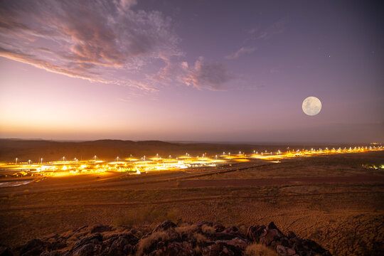 Stunning beautiful landscape sunsetting tropical area with full moon at the background at Wickham town isolated mine site, Karratha, Australia   