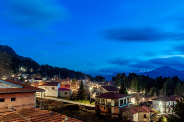 Elati village, panoramic view during the blue hour, just after sunset, of this picturesque traditional mountainous village in central Greece, popular as a winter resort.