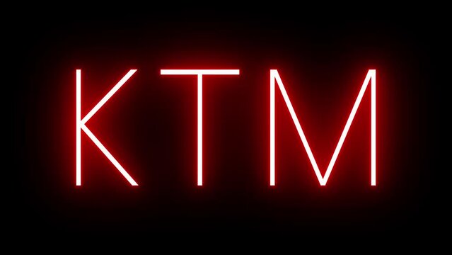 Red retro neon sign with the three-letter identifier for KTM Kathmandu International Airport