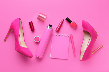 Composition with high-heeled shoes, notebook and different cosmetic products on pink background
