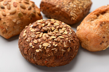 Different delicious buns on white background