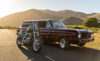 car during sunset with motorcycle