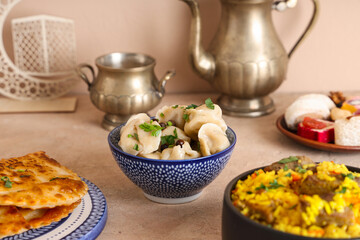 Traditional Eastern dishes and Muslim decor on beige background. Ramadan celebration