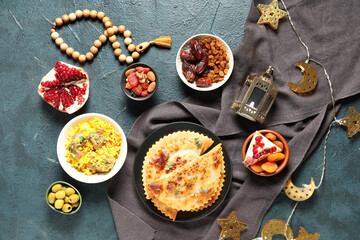 Traditional Eastern dishes, prayer beads and Muslim lantern on grunge table. Ramadan celebration
