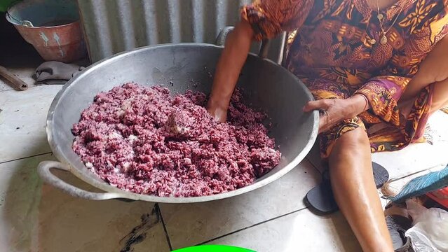 Kneading the dough to prepare a typical Indonesian snack known as dodol