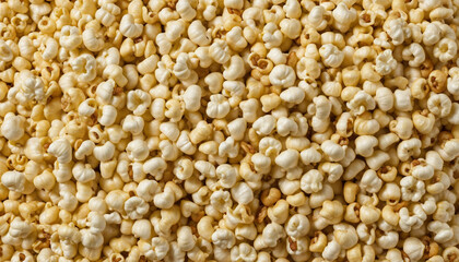 Overhead view of a pail of popcorn on a white surface