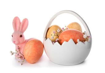 Ceramic basket of Easter eggs and pink bunny on white background