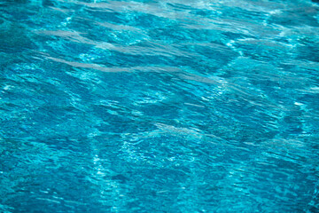 Water in swimming pool, background with high resolution. Wave abstract or rippled water texture.