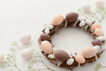 Easter wreath and sprigs of gypsophila on light background