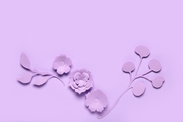 Fototapeta na wymiar Beautiful origami flowers with leaves on purple background