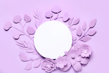 Paper sheet with flowers and leaves on purple background