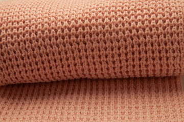 Knitted scarf rolled up