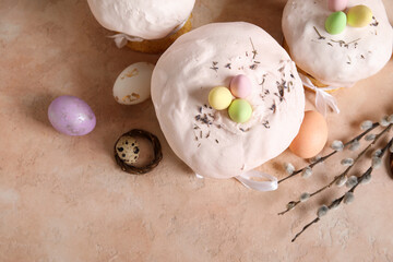 Composition with delicious decorated Easter cakes and painted eggs on color background. Top view