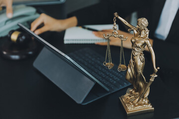 Judge gavel with Justice lawyers having team meeting at law firm background. Concepts of Law and...