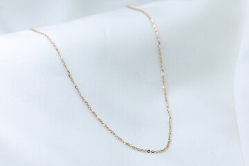 gold necklace chain isolated on white