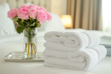 Fototapeta na wymiar Stack of white clean spa towels 