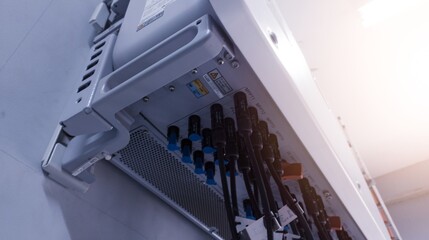 String Cable connecting the power from the solar panel to the inverter with shiny light.