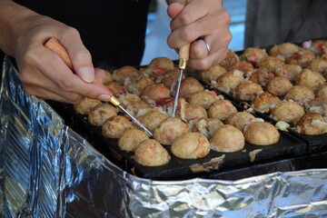 Naklejka premium 屋台のたこ焼き