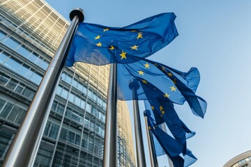 Fluttering EU flag in front of glass building