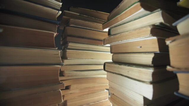 stacked stacks of books, lots of books, old books, a stack of books