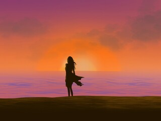 A woman with long hair stands and watches the sunset on the beach.