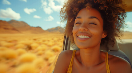 Black women on the road hanging outside a car window, enjoying a window view of the desert, and...