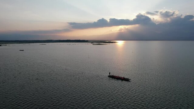 Aerial view of row boat in Phayao lake before sunset by drone