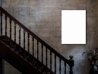 Mockup vertical artist frame, photo or white blank poster on concrete wall background over the empty vintage wooden stairs to the upstair inside the dark old building, loft style.