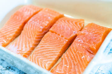Arranging fresh salmon for teriyaki oven baking