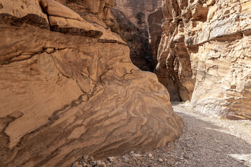 Bizarre natural patterns on the mountain walls on the tourist route of the gorge Wadi Al Ghuwayr or An Nakhil and the wadi Al Dathneh near Amman in Jordan