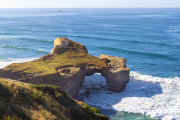 Natural arch at Tunnel beach, Dunedin, New Zealand