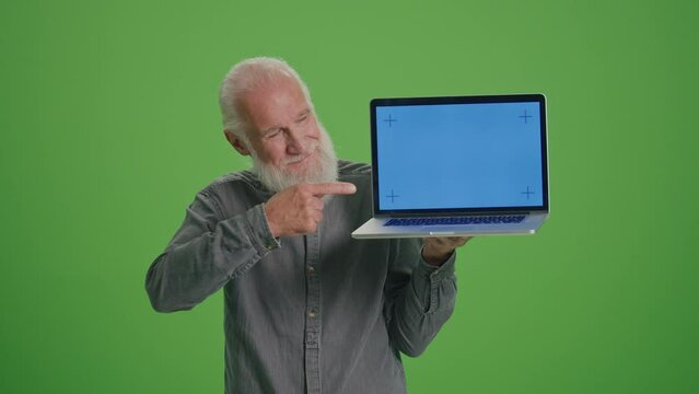 Green Screen.Portrait of an Old Man with a Laptop with a Blue Screen Shows Thumb Up. Digital Literacy and Tech Training for Seniors. Seniors Embracing Digital Technology.