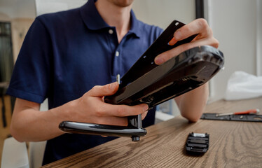 A technician assembles and installs smart electronic door lock for house protection