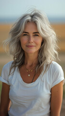 Old Caucasian woman on background summer field.