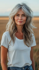 Old Caucasian woman on background summer field.