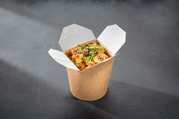 Rice glass noodles with chicken fillet in a wok box, a convenient option for an Asian-inspired quick bite