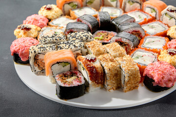 Classic and baked sushi rolls assortment; Philadelphia rolls topped with spicy sauce, a mix of warmth and tradition