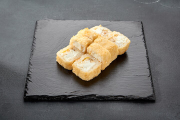 Tempura roll with chicken and cream cheese; a warm fusion roll combining crispy tempura batter with soft, rich flavors