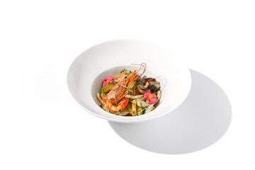 Saute seafood in zucchini with a decorative plating on a white backdrop