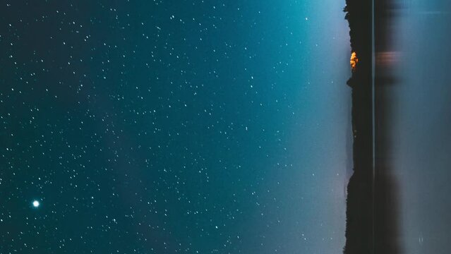 Lyepyel District, Vitebsk Province, Belarus. Real Colorful Night Stars Above Lepel Lake. Natural Starry Sky Background Backdrop Landscape. Time lapse. .