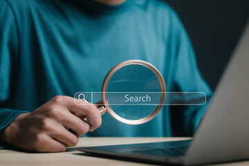 SEO search engine optimization concept, Person using laptop with search bar. Marketing ranking...