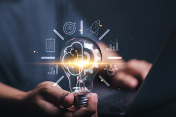 Start up new business idea with creative goal. Person holding light bulb with brain icon for...
