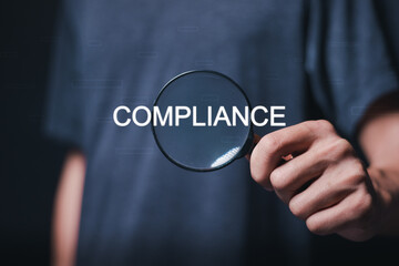 Compliance rules and law regulation policy concept. Person using magnifying glass focus to compliance on virtual screen.
