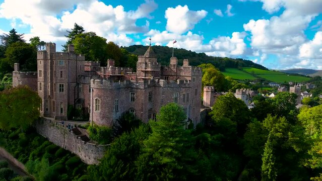 Aerial view of Dunster Castle in the village of Dunster, Somerset, England, UK