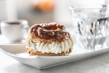 Veternik - sweet donut, typically Slovak caramel sweet cake with cream filling topped with caramel...