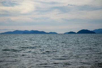 calm landscape of the sea and distant mountains
