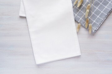 Folded white plain fabric kitchen towel mockup, blank cotton tea towel or napkin, top, view, flat...