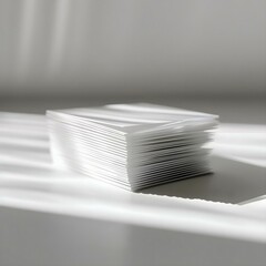 a stack of white cards sitting on top of a table
